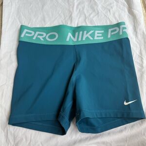 Nike Pro Blue Shorts with Green Waistband